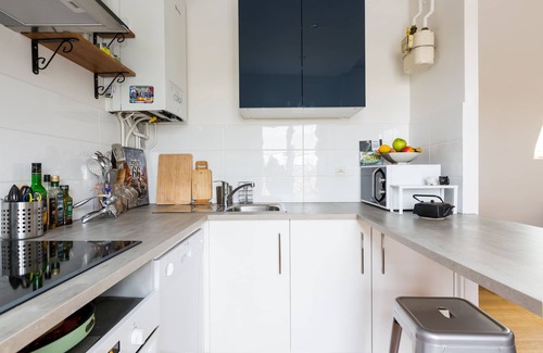 Quartier de la Folie-Mericourt Apartment | Rooftop Views By the Canal Saint-Martin, by Veeve