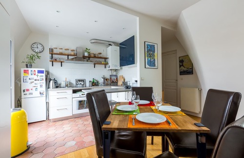 Quartier de la Folie-Mericourt Apartment | Rooftop Views By the Canal Saint-Martin, by Veeve