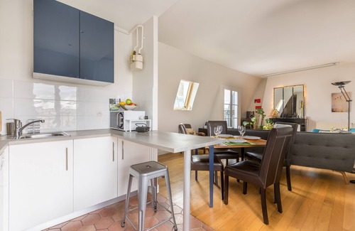 Quartier de la Folie-Mericourt Apartment | Rooftop Views By the Canal Saint-Martin, by Veeve
