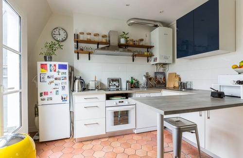 Quartier de la Folie-Mericourt Apartment | Rooftop Views By the Canal Saint-Martin, by Veeve
