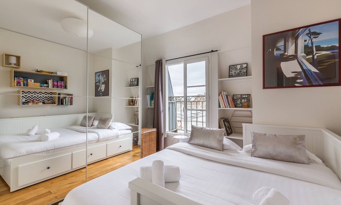 Quartier de la Folie-Mericourt Apartment | Rooftop Views By the Canal Saint-Martin, by Veeve